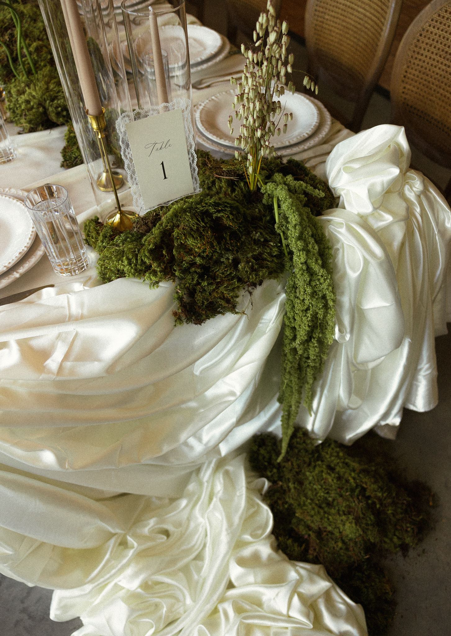 Reception tablescape with moss runner and lace table number